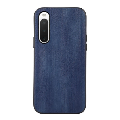 Blue textured PU phone case with camera cutout and slim protective sides.