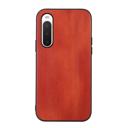 Red textured PU phone case with camera cutout and slim protective edges.