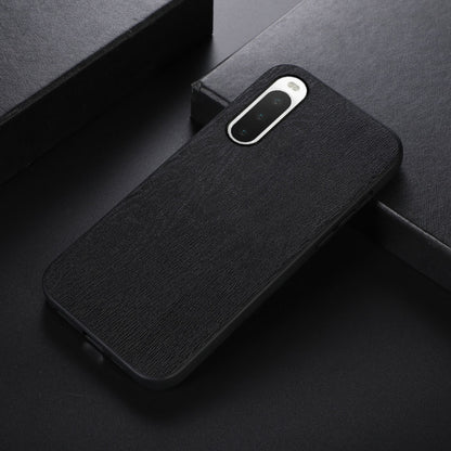 Wood-texture PU phone case with camera cutout, black, slim side angle