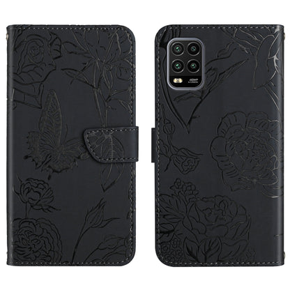 Black flip phone case with embossed butterfly and peony floral pattern, front flap