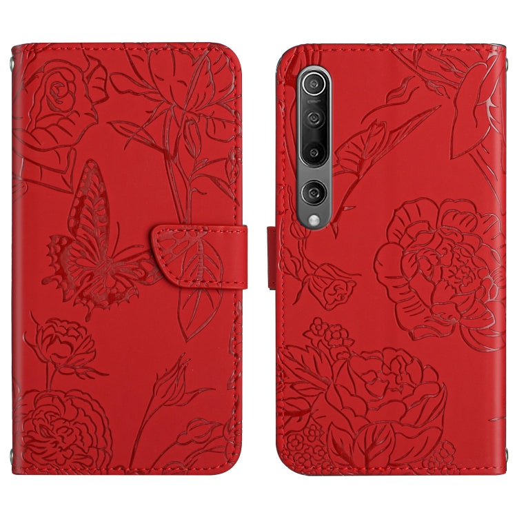 Red flip phone case with embossed butterfly and peony floral pattern, front flap