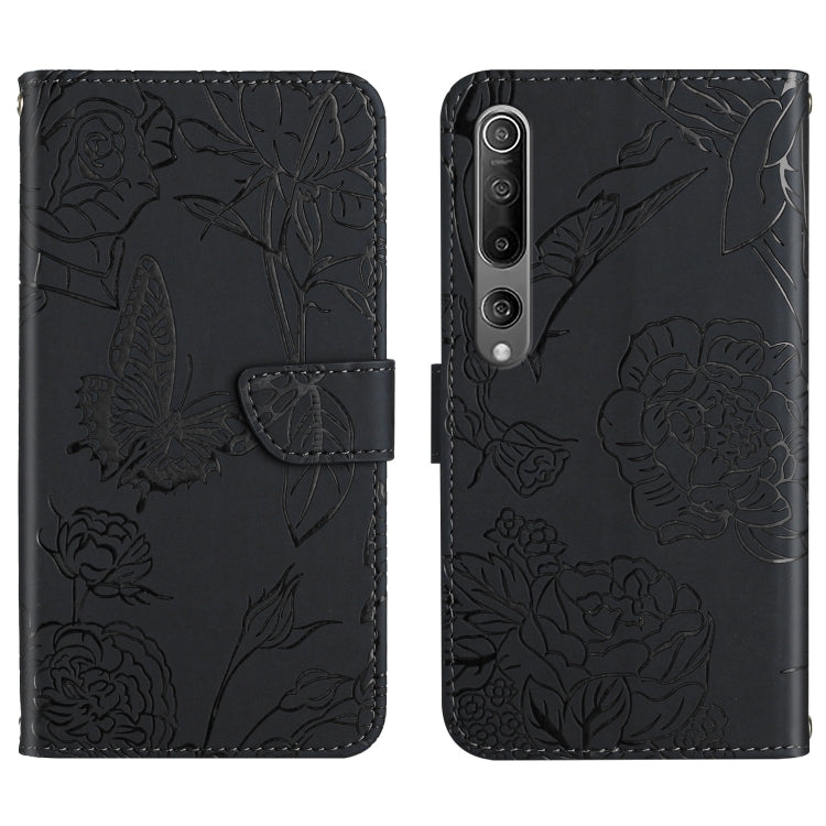 Black flip phone case with embossed butterfly and peony floral pattern, camera cutouts