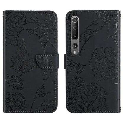 Black flip phone case with embossed butterfly and peony floral pattern, camera cutouts