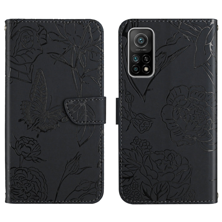 Black wallet-style embossed leather phone case with butterfly and peony floral pattern
