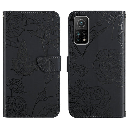 Black wallet-style embossed leather phone case with butterfly and peony floral pattern