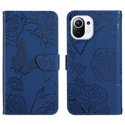 Blue wallet-style embossed leather phone case with butterfly and peony floral embossing