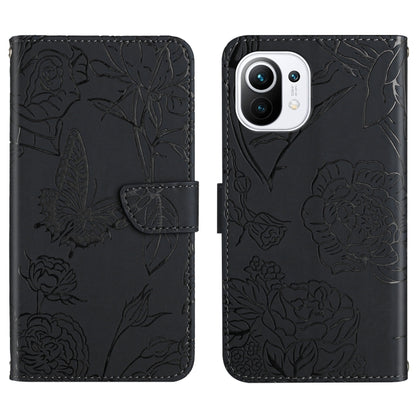 Black embossed leather-style folio phone case with butterfly and peony pattern, flap and pocket