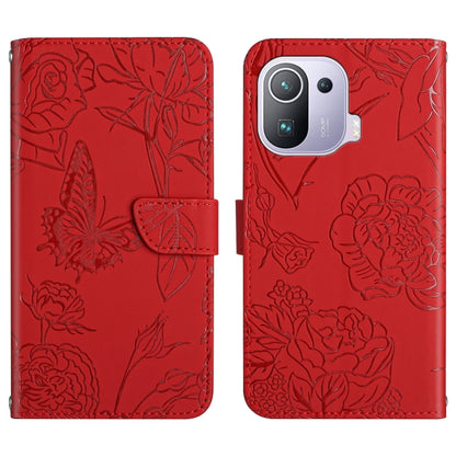 Red embossed leather-style folio phone case with butterfly and peony pattern, flap and pocket