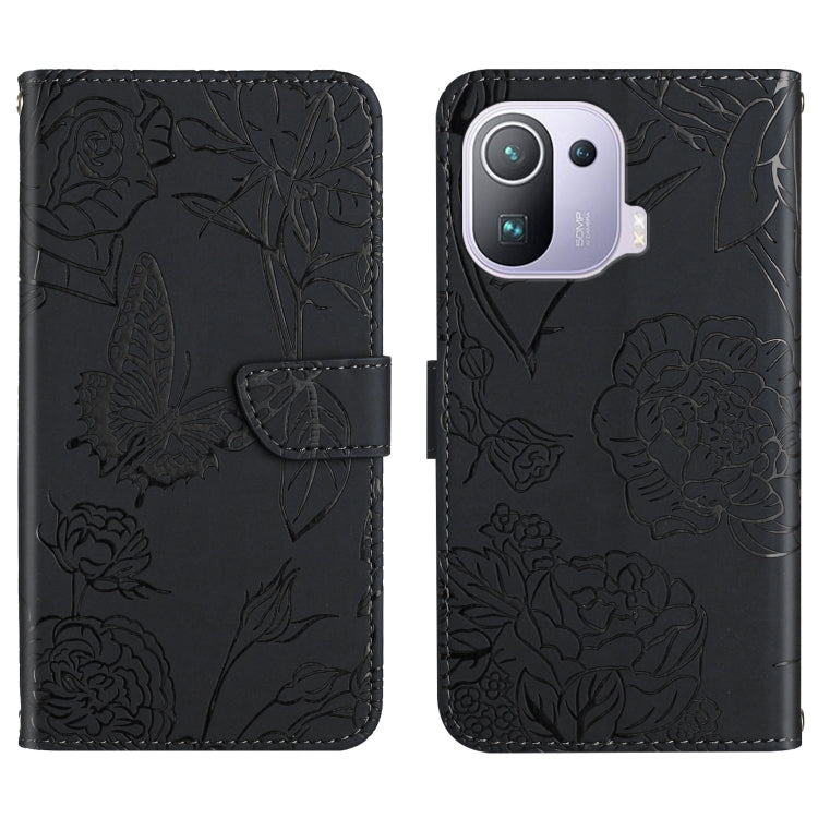 Black embossed leather-style folio phone case with butterfly and peony pattern and camera cutout