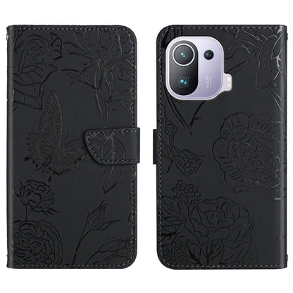 Black embossed leather-style folio phone case with butterfly and peony pattern and camera cutout