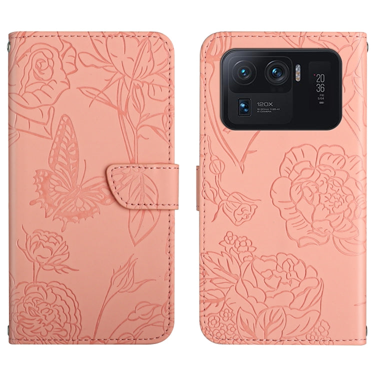 Pink embossed leather-style folio phone case with butterfly and peony pattern and camera cutout