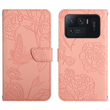 Pink embossed leather-style folio phone case with butterfly and peony pattern and camera cutout