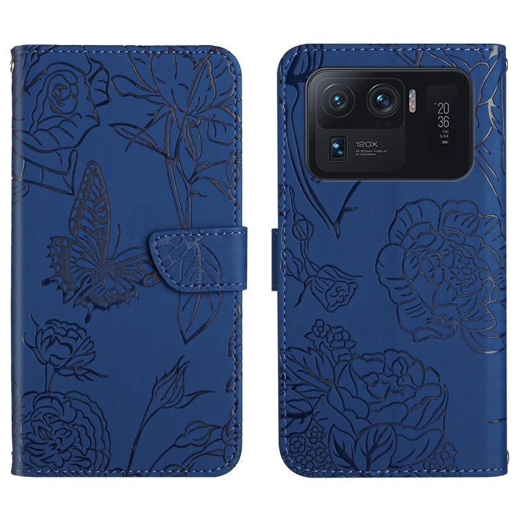 Blue embossed leather-style folio phone case with butterfly and peony pattern and camera cutout