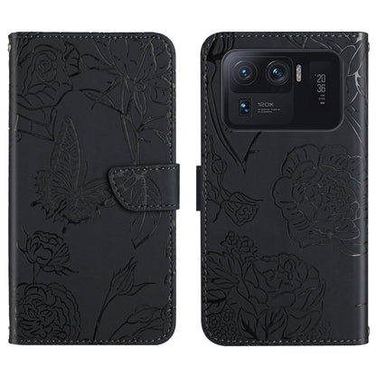 Black embossed floral/butterfly folio phone case with front flap and card slot