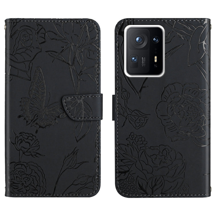 Black embossed floral butterfly phone wallet case with cutouts for camera and ports