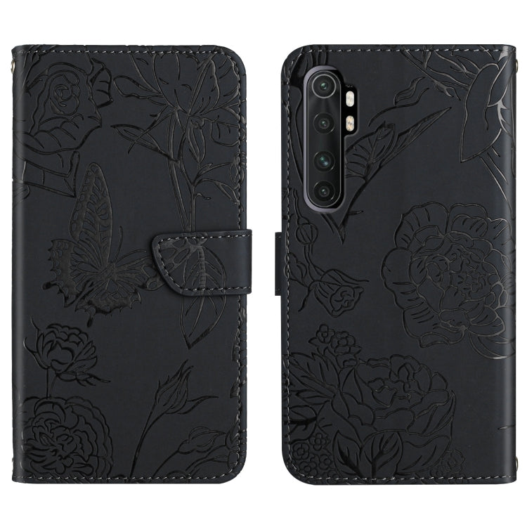 Black embossed leather folio phone case with butterfly peony floral pattern and flip strap.