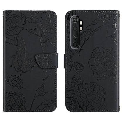 Black embossed leather folio phone case with butterfly peony floral pattern and flip strap.