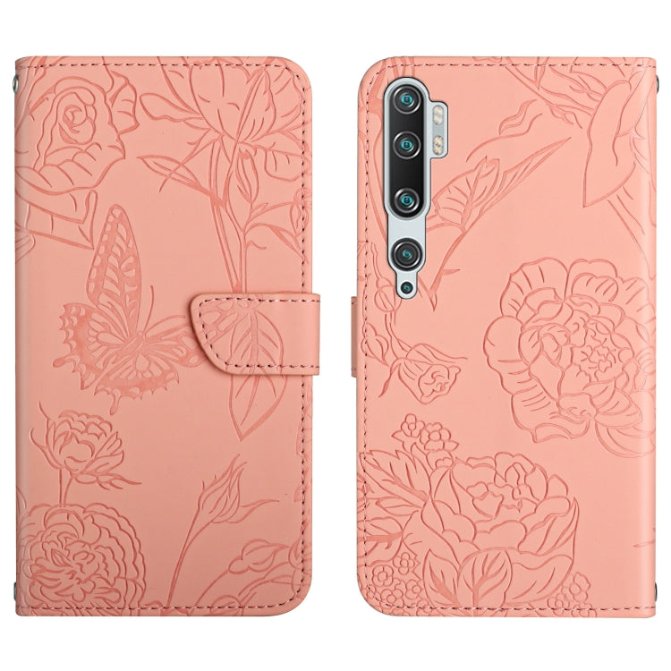 Pink embossed leather folio phone case with butterfly peony floral pattern and flip strap.