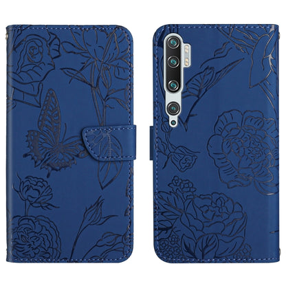 Blue embossed leather folio phone case with butterfly peony floral pattern and flip strap.