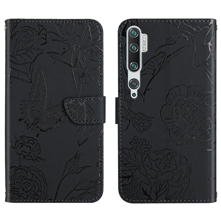 Black embossed leather folio phone case with floral butterfly relief and camera cutouts.