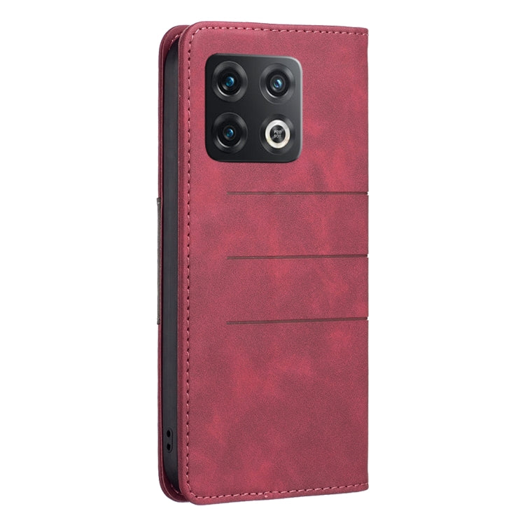 Red leather phone case with camera cutouts and magnetic flip seam.