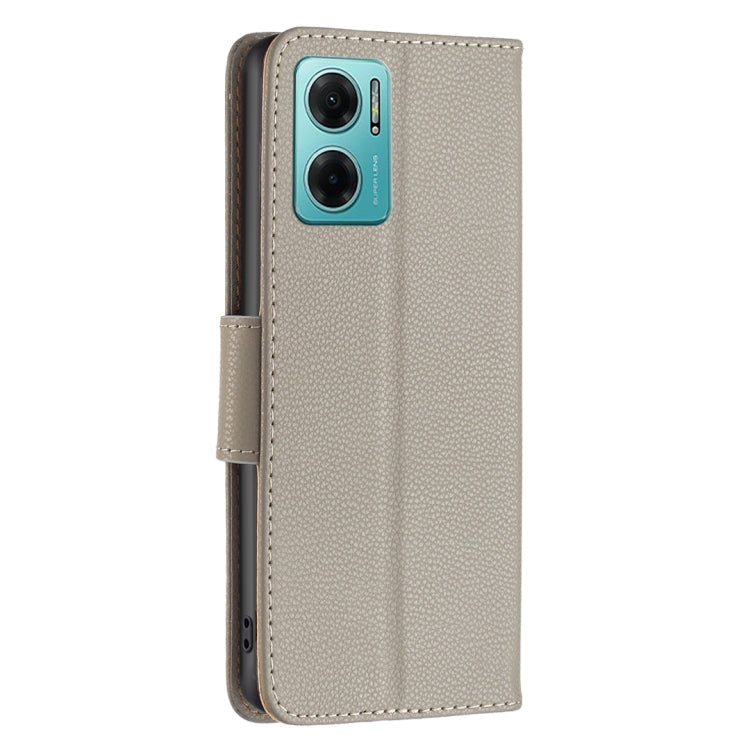 Light grey litchi-texture leather phone case with side strap and camera cutouts