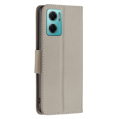 Light grey litchi-texture leather phone case with side strap and camera cutouts