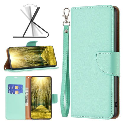 Mint green leather wallet phone case with flip cover, wrist strap, and card slot pocket.