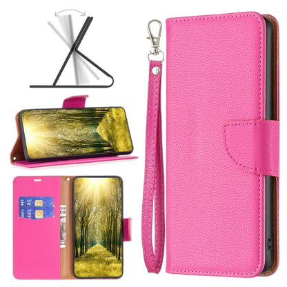 Hot pink leather wallet phone case with flip cover, wrist strap, and card slot window.