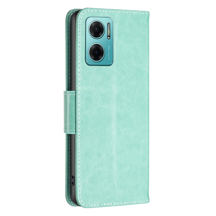 Mint green leather phone case with butterfly embossing and dual camera cutout