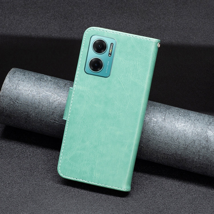 Mint green leather phone case with butterfly embossing and dual camera opening