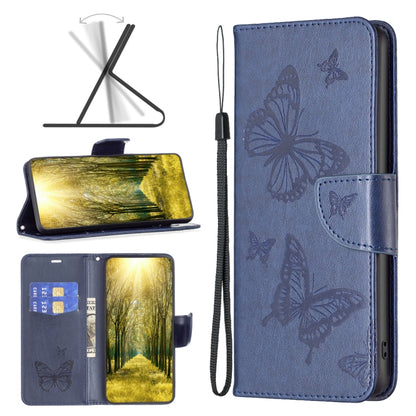 Blue leather phone case with embossed butterflies, flip cover, and wrist strap