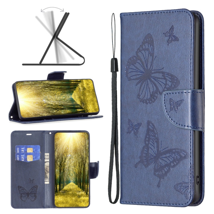 Blue leather phone case with embossed butterflies, flip cover, and wrist strap