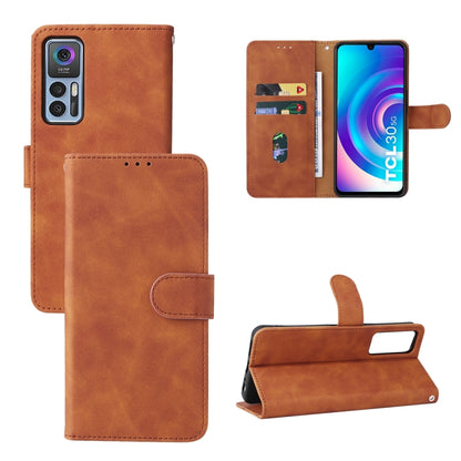Brown leather magnetic flip phone case with card slots and front camera cutout.