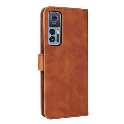 Brown leather magnetic flip phone case showing camera cutout and side stitching.