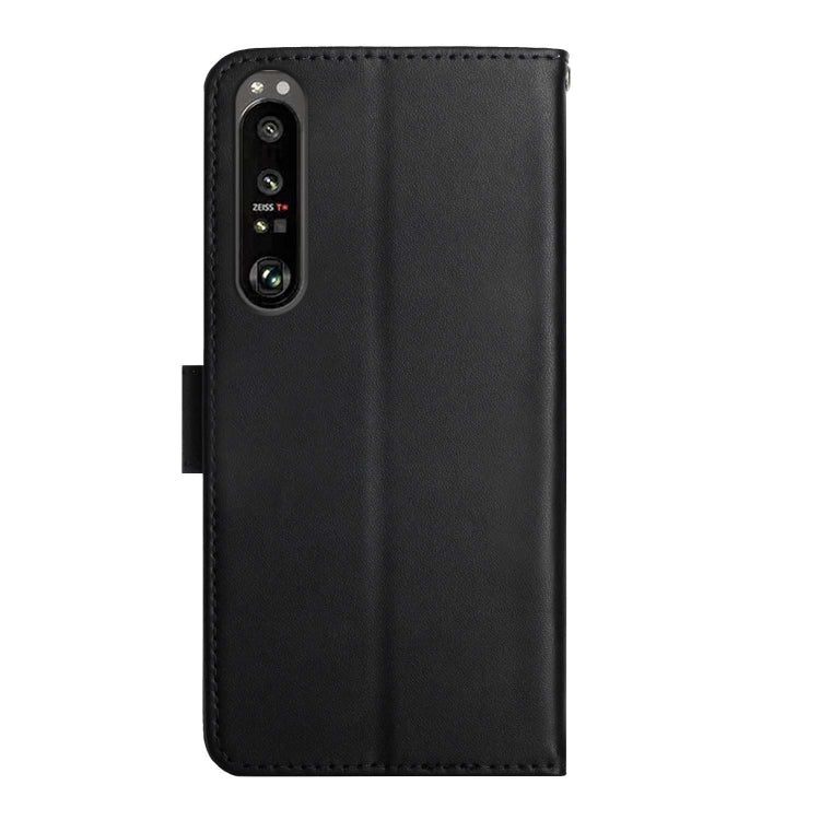 Black leather flip phone case with phone back exposed through camera opening