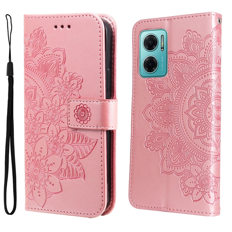 Rose pink leather wallet phone case with embossed seven-petal floral pattern and wrist strap