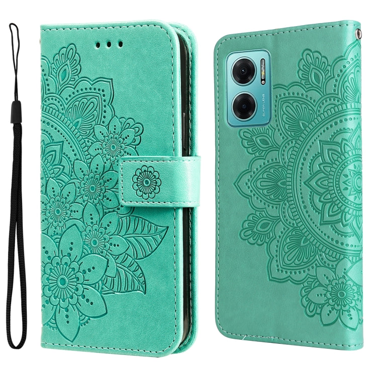 Mint green leather wallet phone case with embossed seven-petal floral pattern and wrist strap