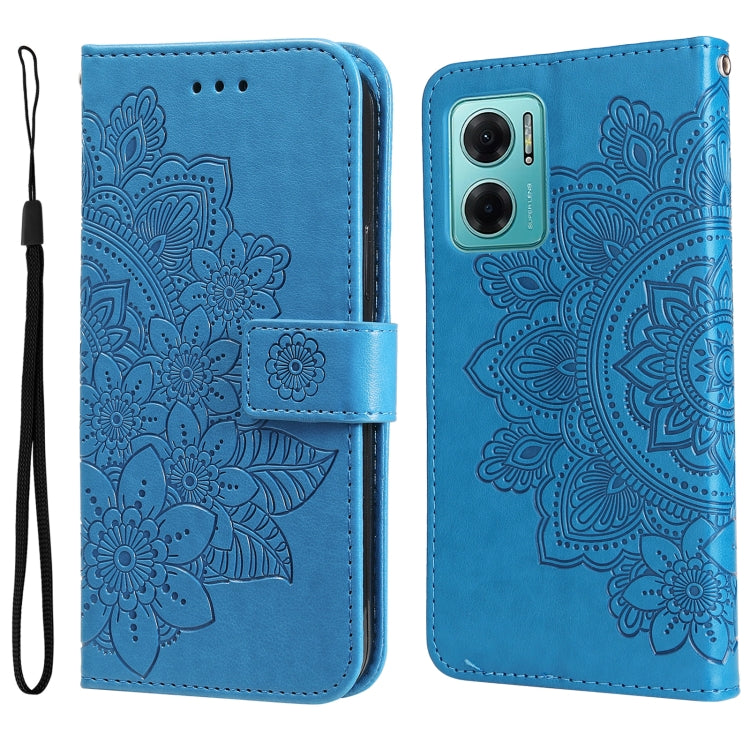 Blue leather wallet phone case with embossed seven-petal floral pattern and wrist strap