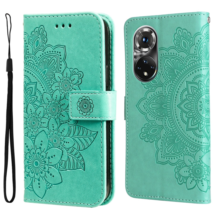 Light teal embossed floral flip leather wallet phone case with wrist strap.