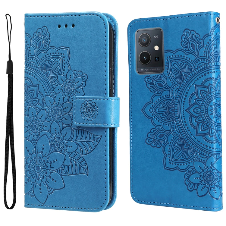 Blue folio leather phone case with floral mandala embossing, camera cutout, wrist strap.
