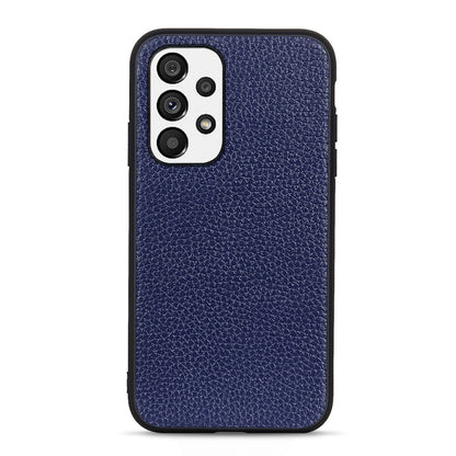 Blue genuine leather phone case with litchi textured finish and camera cutout detail