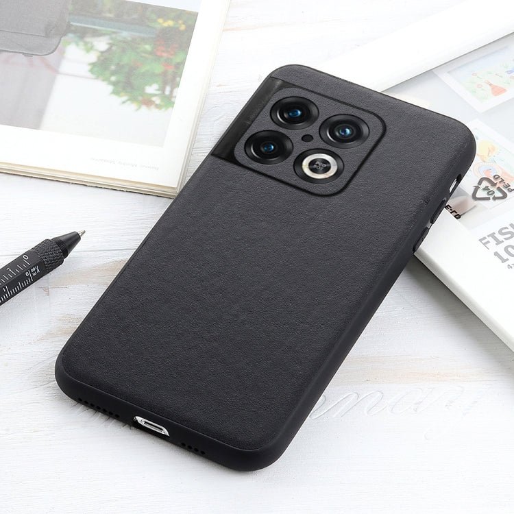 Black leather phone case with textured finish, camera cutouts, and bottom port openings.