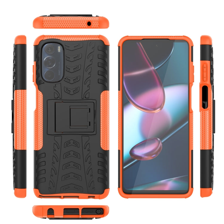 Tire-texture phone case set with holder, orange and black, showing front, back, and sides.