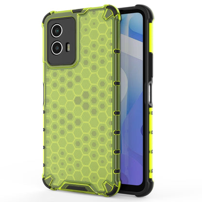 Green shockproof phone case with hex honeycomb pattern, raised edges, and camera cutouts