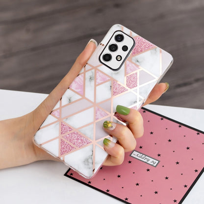 Geometric pink and white TPU phone case with marble rhombus pattern, held in hand