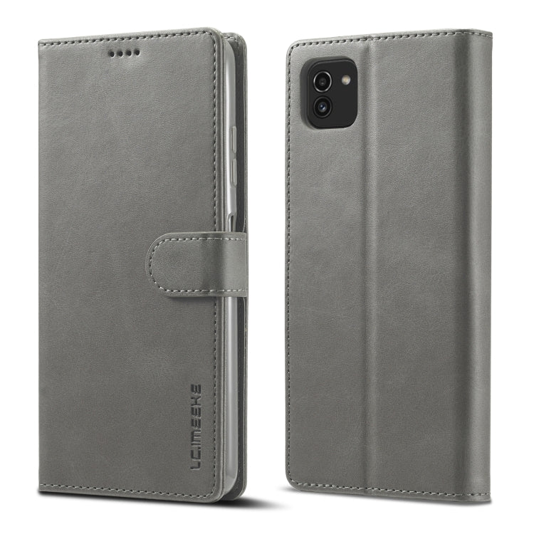 Grey leather flip phone wallet case with magnetic strap and camera cutout on back.