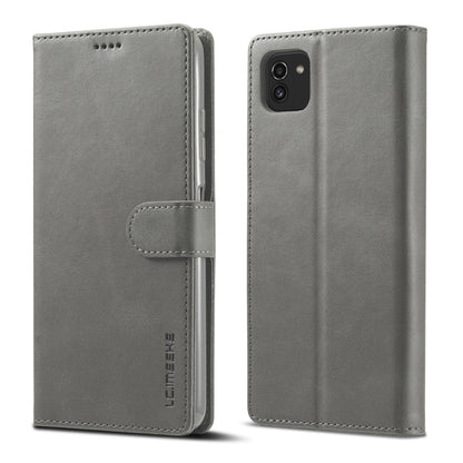 Grey leather flip phone wallet case with magnetic strap and camera cutout on back.