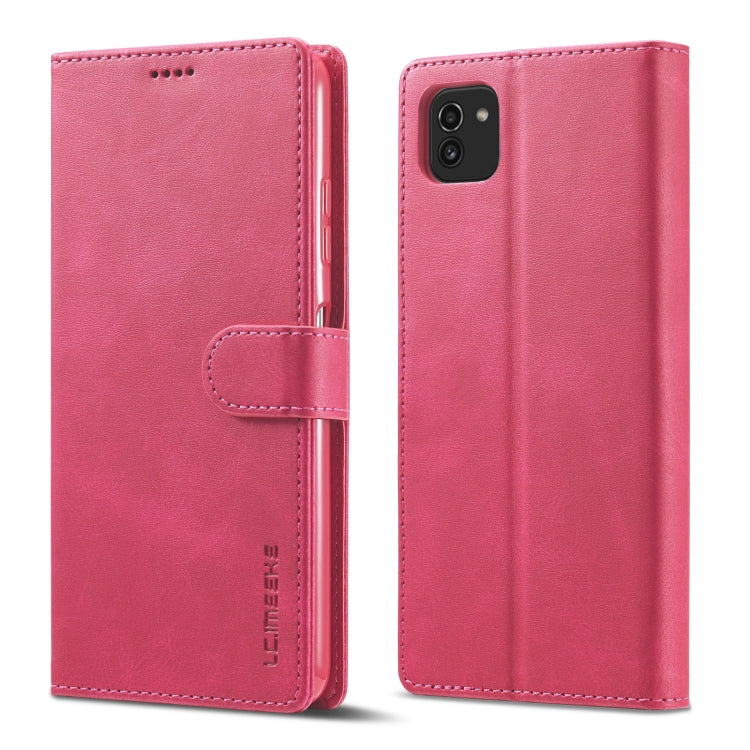 Pink leather flip phone wallet case with magnetic strap and camera opening on back.