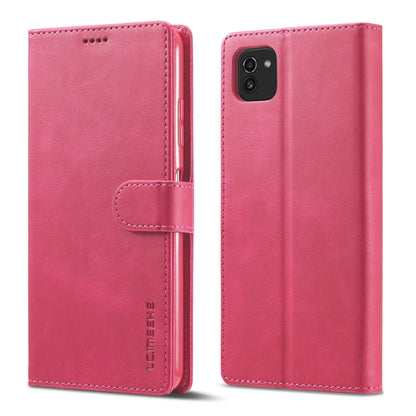 Pink leather flip phone wallet case with magnetic strap and camera opening on back.